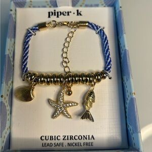 Viral Piper K Gold Fish Charm Bracelet with Blue Cord
